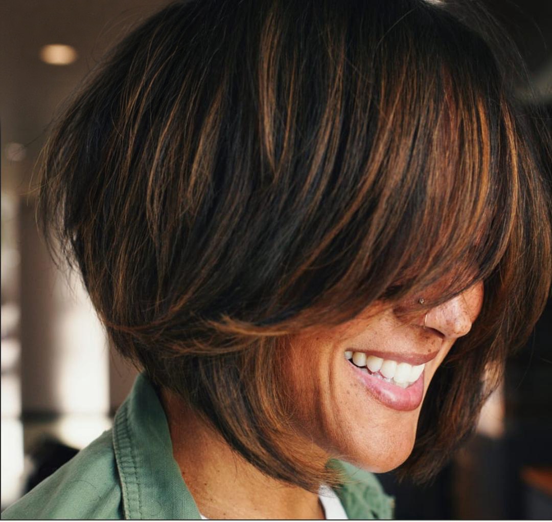 Brunette layered bob with a long sweeping fringe