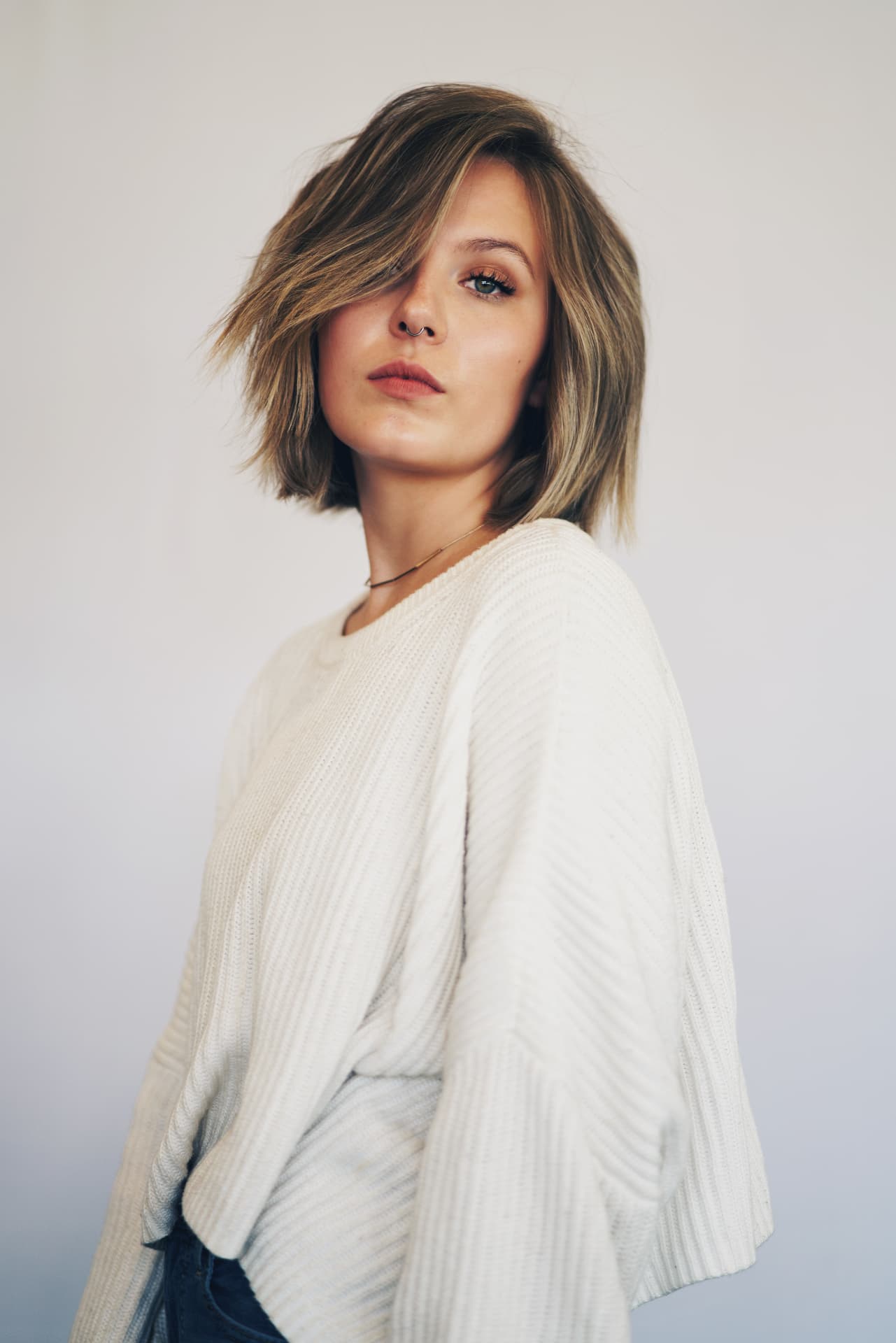 Bronde piecey chin-length bob with a deep side part